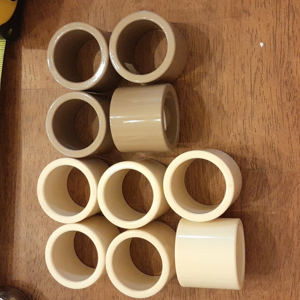 Set of 10 Plastic Napkin Rings. 6 cream and 4 Taupe/Tan.